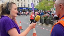 Runners starting to cross the finish line behind Rachel and Simon....