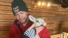 Nathan holding a lamb