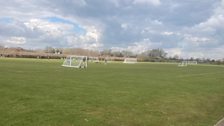 The team headed for a football ground that was getting ready for a charity match...