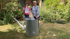 Clue three was in the spout of this giant watering can in Julia's garden at Tudor Lodgings in Castle Acre