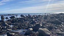 A rocky shore here at Criccieth