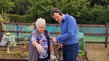 Pat showing David her raised bed!