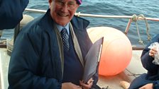 Robbie on board a boat to Tiree