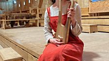 Playing a lyre in the King's Hall at Lejre