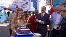 Christina Trevanion bringing out the anniversary cake