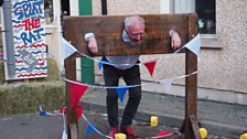 Colin Young getting a soaking in the stocks