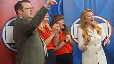 The red team watch as their items go under the hammer