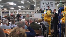A busy saleroom with auctioneer Tim Weeks on the rostrum