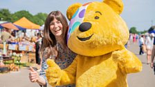 Presenter Natasha Raskin Sharp and Pudsey Bear at Ardingly antiques fair