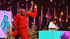 MNEK performing on stage