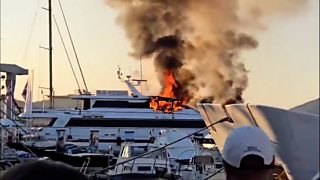 Smoke billows from luxury yacht fire ...