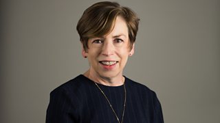 A woman wearing a navy blue top