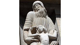 Eric Gill's statue of Prospero - a bearded man with long wavy hair, head turned to one side.