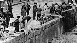 The Berlin Wall being built.