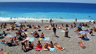 People sunbathing on a beach