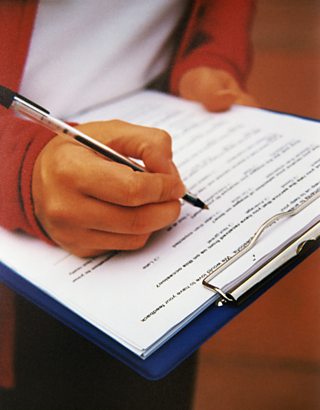 Data collection sheet being filled out by a person with a clipboard