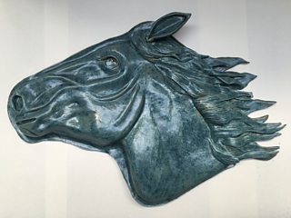 Student horse head relief sculpture with brush-on glaze