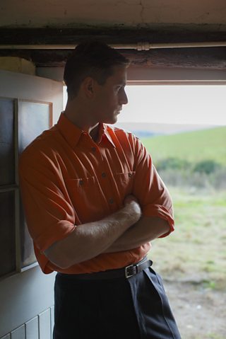 man with an orange shirt