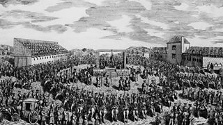 A drawing of an outside scene where a man is hanging from a gallows which is encircled by soldiers. People are watching from surrounding buildings.