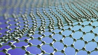 A close-up view of a graphene structure that looks like an atomic-scale honeycomb lattice.