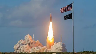 NASA's Artemis II Space Launch System rocket carrying the Orion spacecraft lifts off.