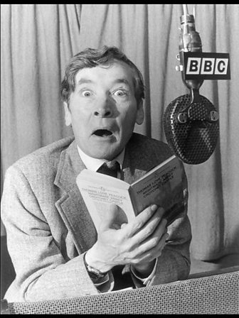 Black and white shot of Kenneth Williams in a radio studio at BBC Broadcasting House in 1956