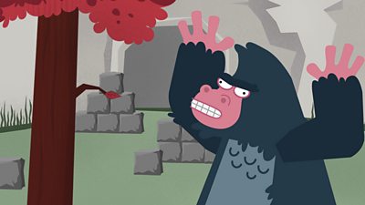 An angry gorilla looking at blocks outside his house.