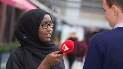 BBC apprentices conducting an interview with a BBC microphone
