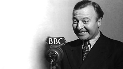 Black and white image of Arthur Haynes in front of microphone with BBC on it