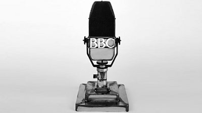A square BBC microphone with a heavy stand. 
