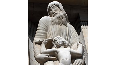 Eric Gill's statue of Prospero - a bearded man with long wavy hair, head turned to one side.