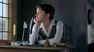 Frances O'Connor as Fanny Price looks dreamily out of the window from her writing desk
