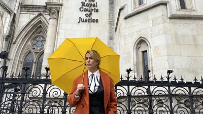 Faith Howells (Eve Myles) standing outside The Royal Courts of Justice