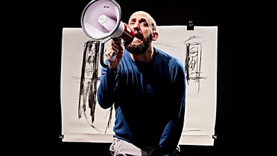 Jonny Cotsen holding a microphone