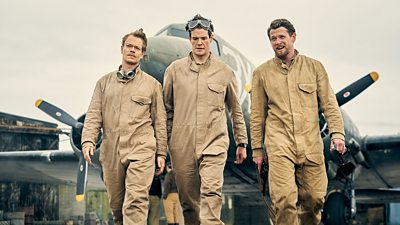 Alfie Allen, Connor Swindells and Jack O'Connell in SAS: Rogue Heroes. They're pictured as a trio of airmen standing in front of a plane.