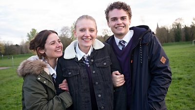 Poppy Lee Frair who plays Lydia, stands between Gabrielle Creevy who plays Bethan and James Wilbraham who plays Travis.