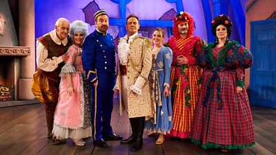 The cast of Not Going Out and special guest star Jason Donovan pose in pantomime costume on a stage.
