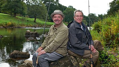 Bob Mortimer and Paul Whitehouse pose with their fishing rods.