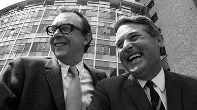 Eric Morecambe and Ernie Wise pictured in black and white.