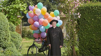 Mark Williams as Father Brown photographed with 100 biodegradable balloons.