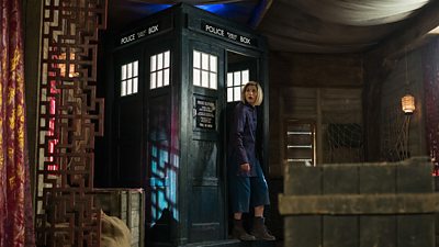Jodie Whittaker's Doctor emerges from the TARDIS in the bowels of a ship