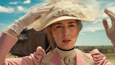 Emily Blunt holds on to her hat in The English