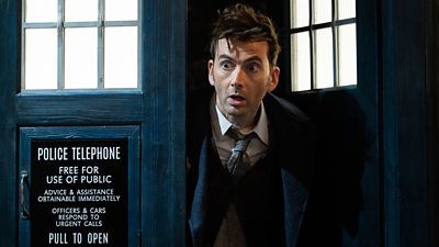 David Tennant's 14th Doctor peers out the door of the TARDIS looking shocked