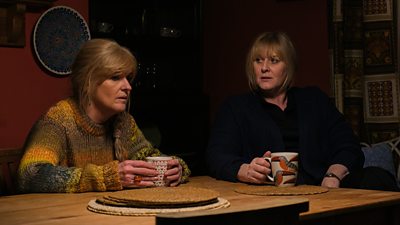 Claire (Siobhan Finneran) and Catherine (Sarah Lancashire) sit at a table drinking tea