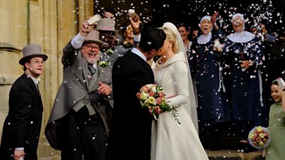 Trixie (Helen George) and Matthew (Olly Rix) kiss outside the church as the nuns, Fred and Reggie smile and throw confetti over them