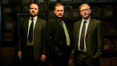 Gareth John Bale as DC Geraint Bale, Philip Glenister as DCI Paul Bethell and Steffan Rhodri as Phil Bach Rees in Steeltown Murders