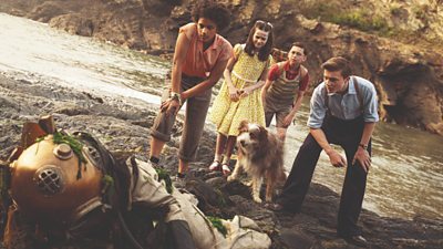 Picture shows: Cousins George, Julian, Dick and Anne, along with Timmy the Dog, make a gruesome discovery - the body of a diver washed up on the beach.