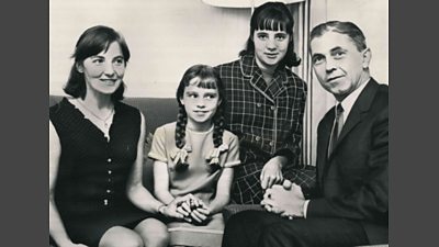 A black and white photo of four members of The Niedermayer Family.