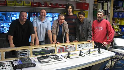 Six men in the gallery in Leeds admire their work