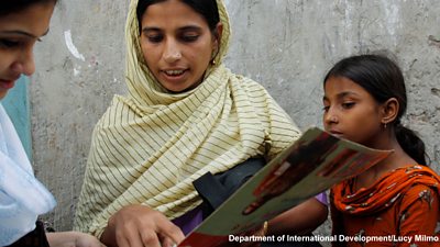 A community health worker conducts a survey in the Korail slum, Bangladesh.